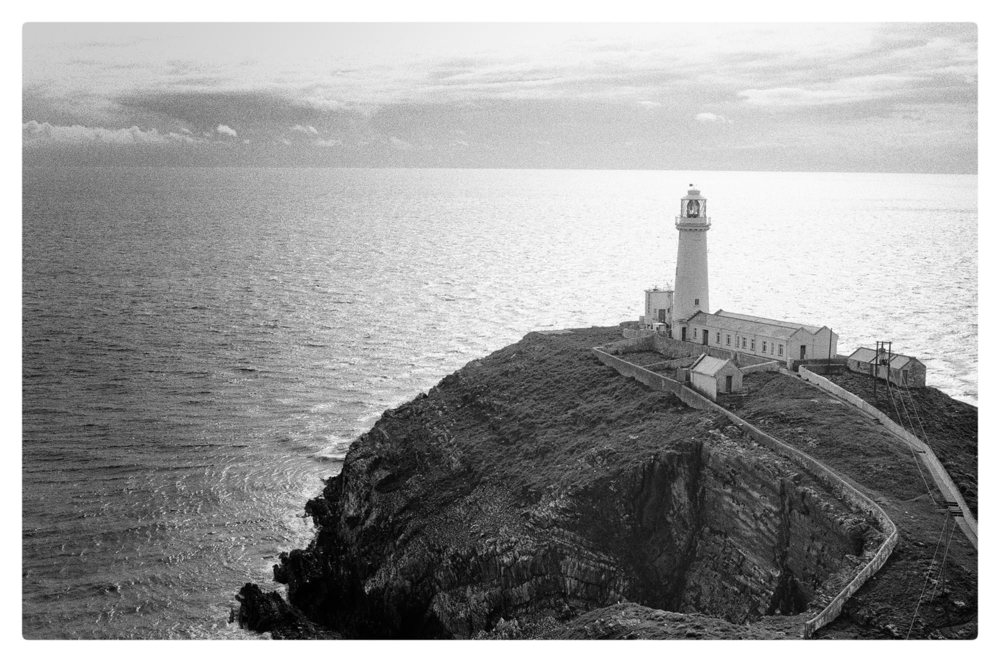 Black and white film photo of the south stack lighthouse
