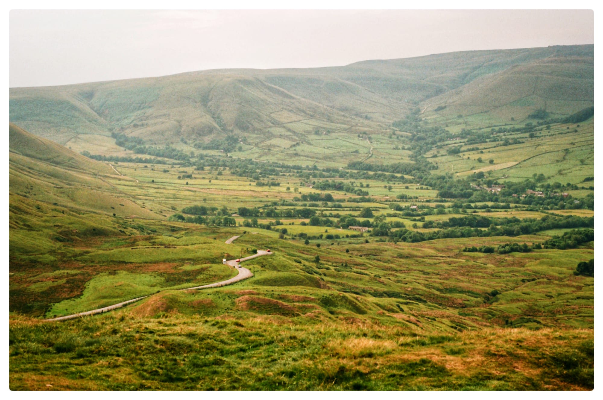 A hazed film picture of the landscape view of the peak of Mam Tor at the Peak District