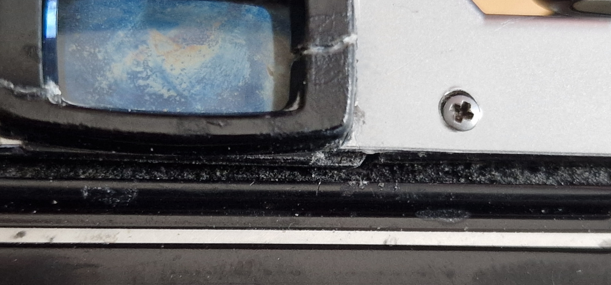 The viewfinder slightly pushes out over the foam on the pentax MG causing the caddy to not close fully