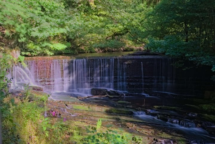 Long exposure shot of a weir, with misty water 